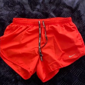 Red/orange Nike running shorts